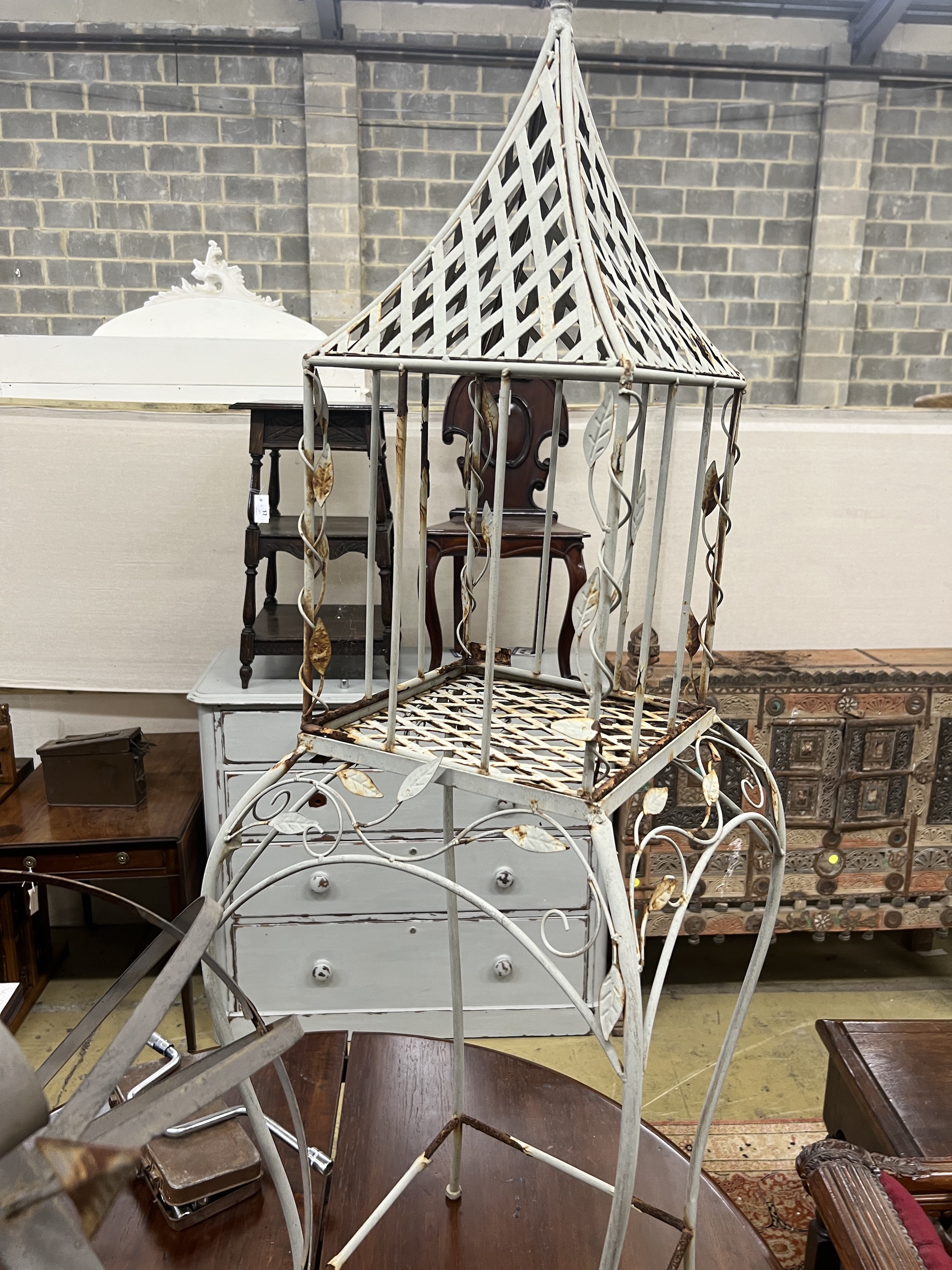 A painted metal armillary sphere, height 84cm together with a lantern